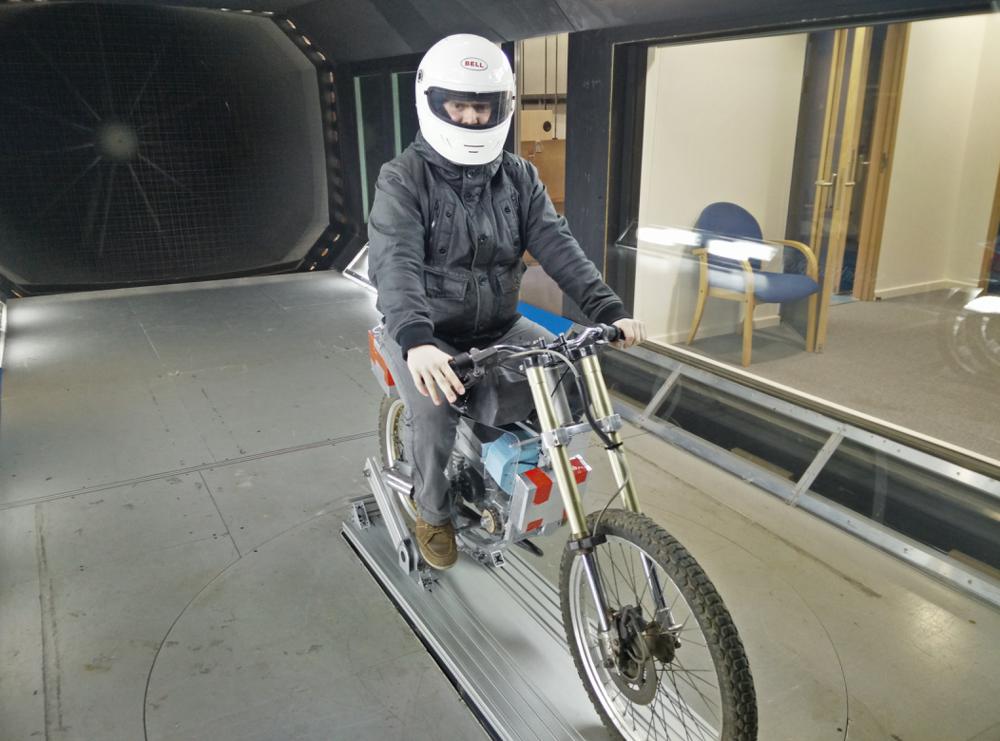 Finished e-motorcycleTesting on the rolling roadTesting in the wind tunnelTesting on the actual roadTesting on the actual road, stunt driving by yours trulyWe would always breakout the laser cutter or 3D printer at the drop of a hat